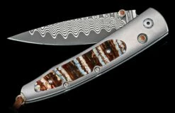 Reverso Titanium Pocketknife Featuring Fossil Mammoth Tooth And 'wave' Damascus Blade