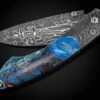 Blue Fusion Pocketknife Featuring Etched Damascus, Fossil Mammoth Tusk, And Damascus Blade