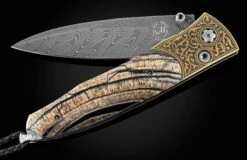Golden Eye Folding Knife With Inlaid 24K Gold, Fossil Woolly Mammoth Tusk, And Damascus